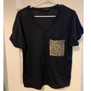 Black top with leopard print pocket